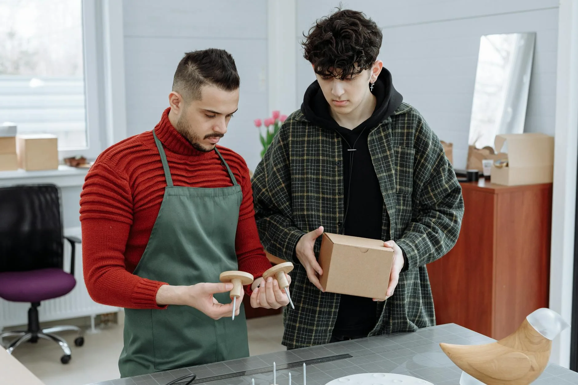Apprentice working on-site with employer supervisor